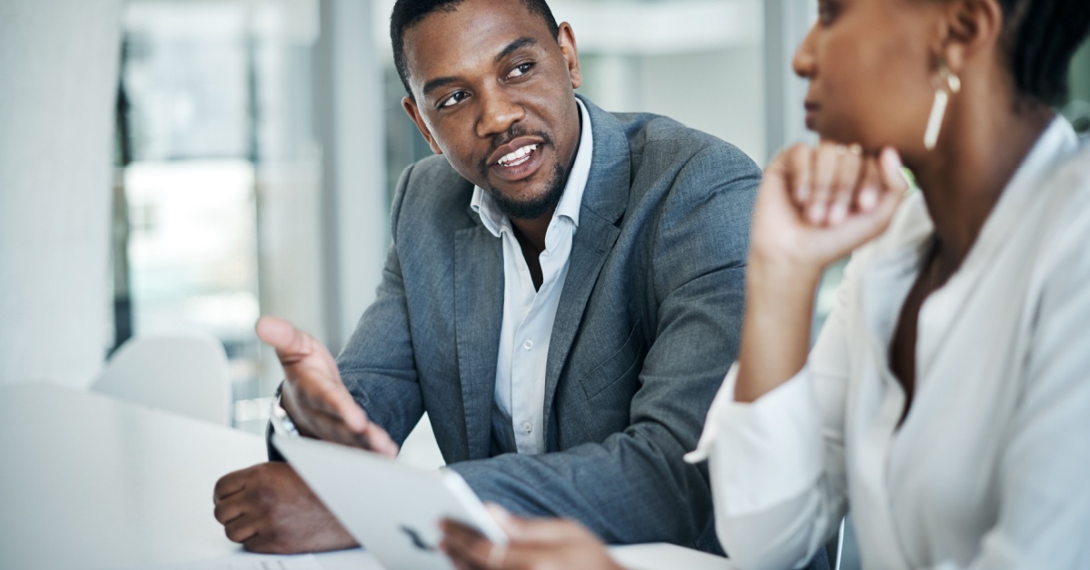 two edd graduates discussing business strategy