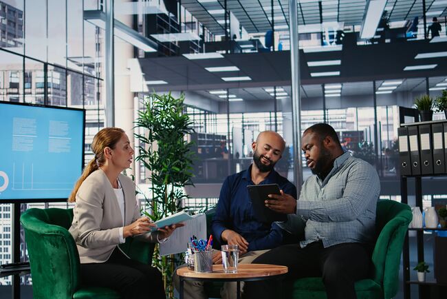 business leaders sharing expertise and developing a strategy through collaboration and partnership in a corporate environment