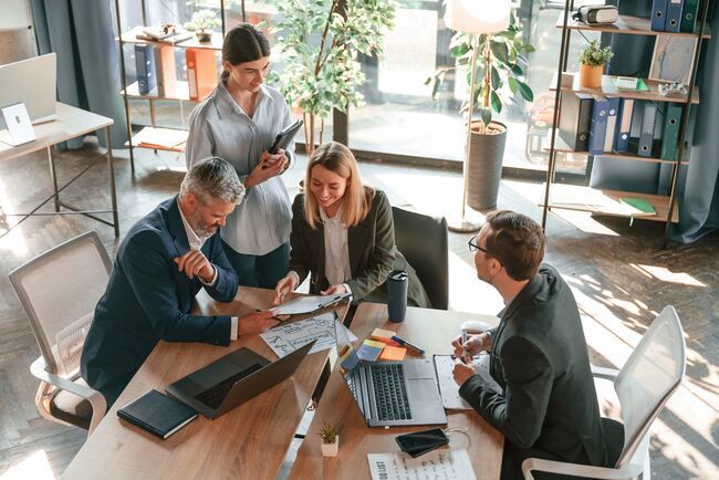 group of business leaders sharing performance data
