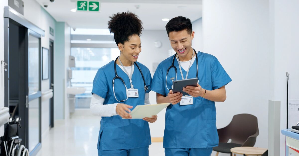 two hospital nursing students in discussion