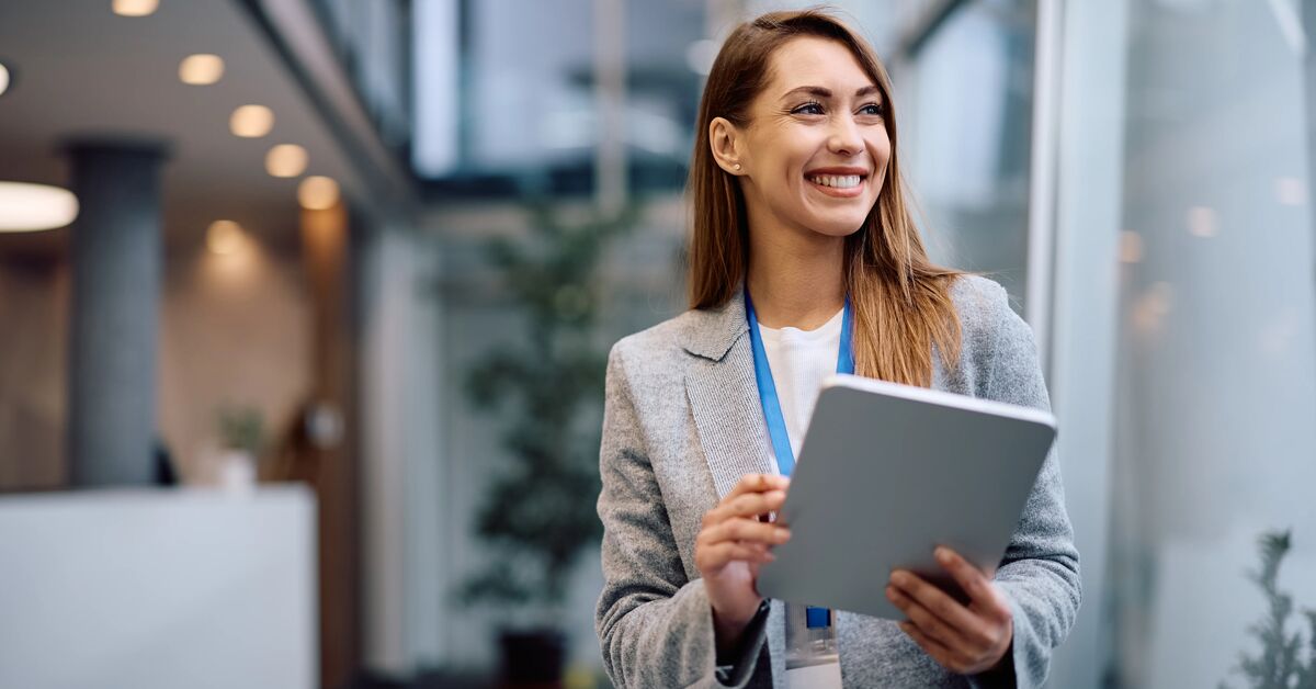young business leader looking at her tablet