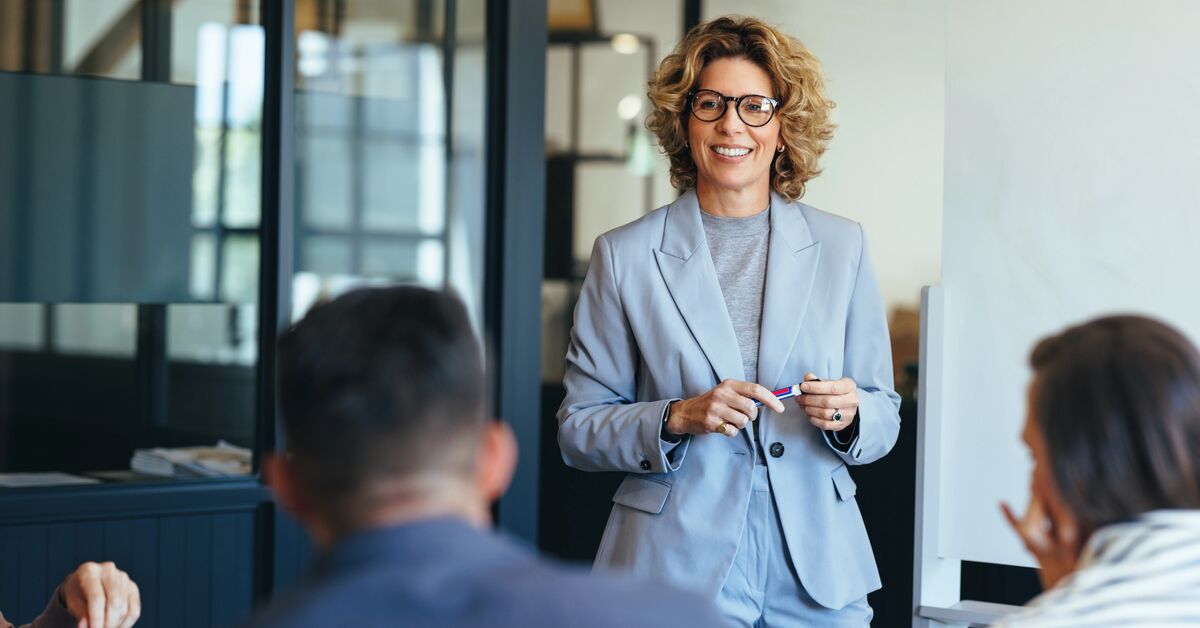 business woman having a discussion with her team