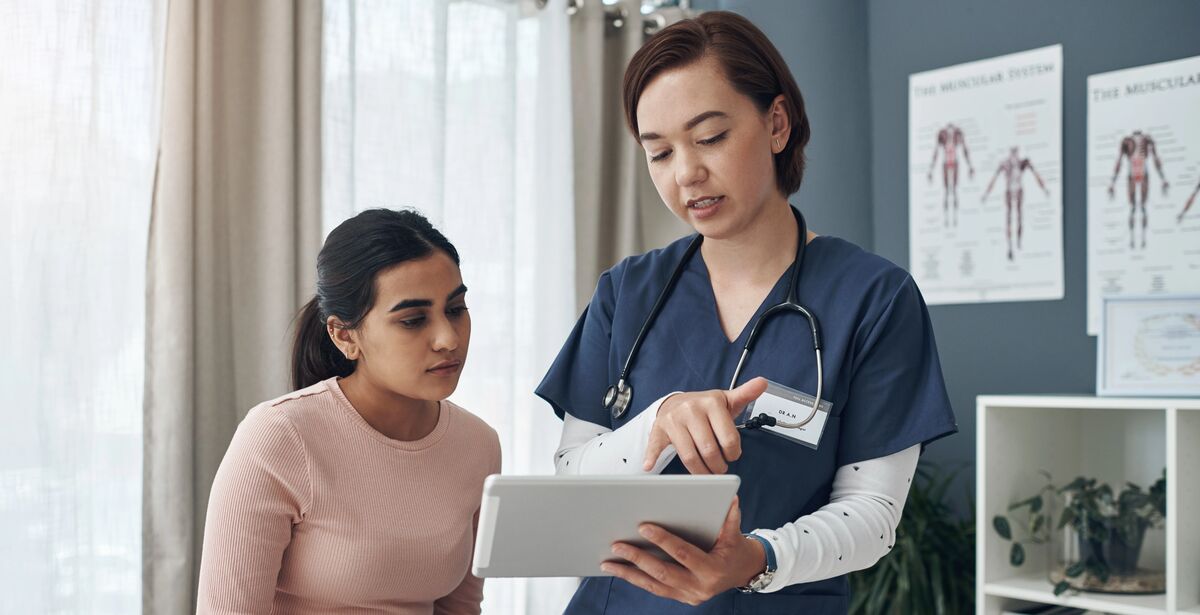 young female doctor talking to a patient in an office 